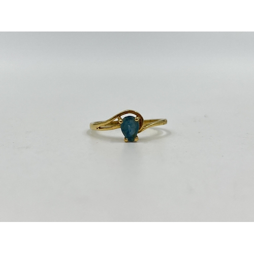 1232 - A 14ct gold aquamarine solitaire ring, size M - approx. gross weight 1.34 grams