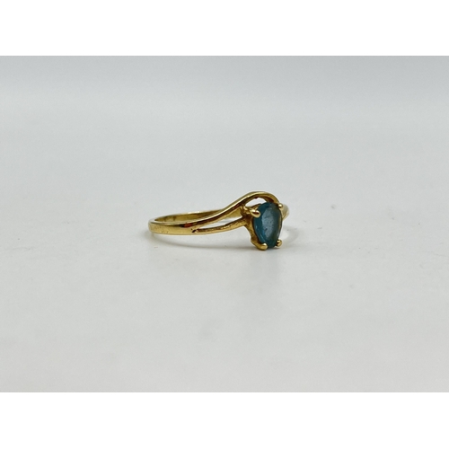 1232 - A 14ct gold aquamarine solitaire ring, size M - approx. gross weight 1.34 grams