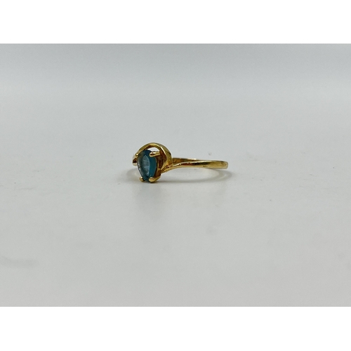 1232 - A 14ct gold aquamarine solitaire ring, size M - approx. gross weight 1.34 grams