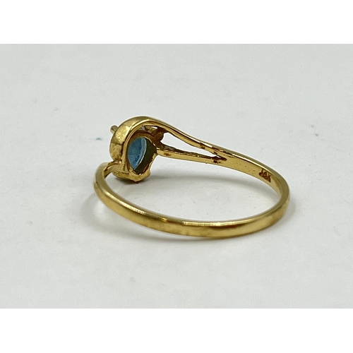 1232 - A 14ct gold aquamarine solitaire ring, size M - approx. gross weight 1.34 grams