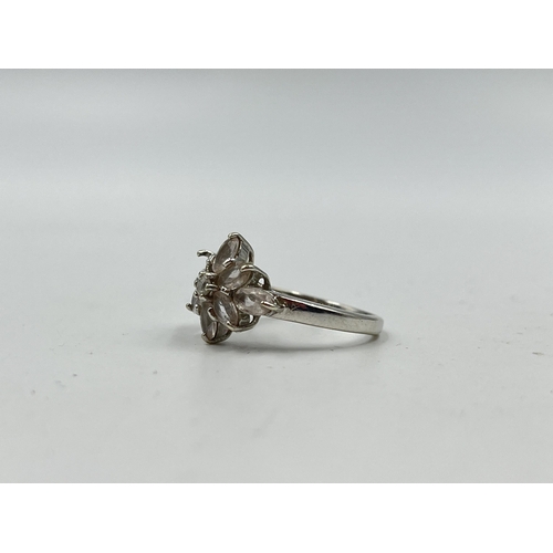 1233B - A hallmarked 9ct white gold CZ floral cluster ring, size N½ - approx. gross weight 3.56 grams