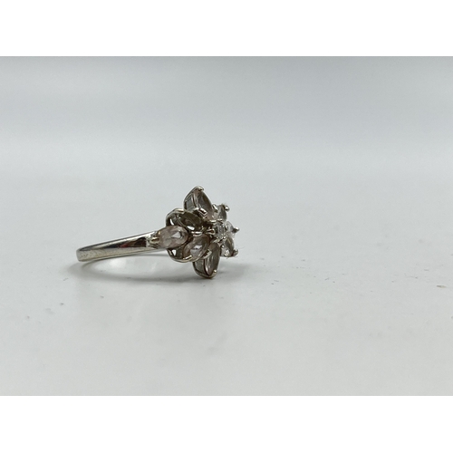 1233B - A hallmarked 9ct white gold CZ floral cluster ring, size N½ - approx. gross weight 3.56 grams