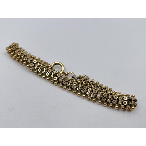 1240 - A Victorian 9ct gold 22cm floral panel bracelet - approx. gross weight 14.84 grams