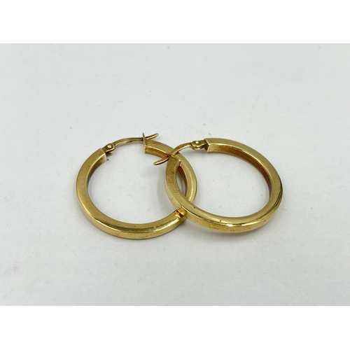 1243 - A pair of hallmarked 9ct gold hoop earrings - approx. gross weight 2 grams and 2.5cm diameter