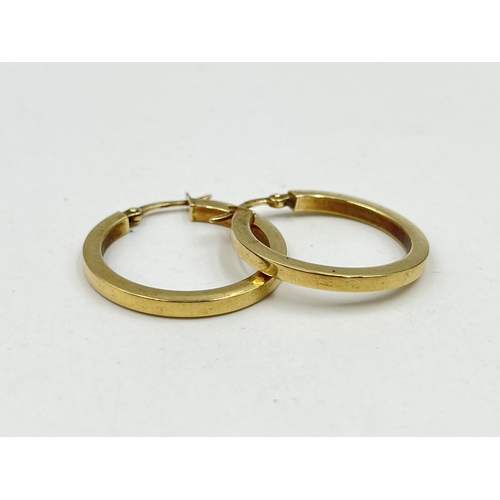 1243 - A pair of hallmarked 9ct gold hoop earrings - approx. gross weight 2 grams and 2.5cm diameter