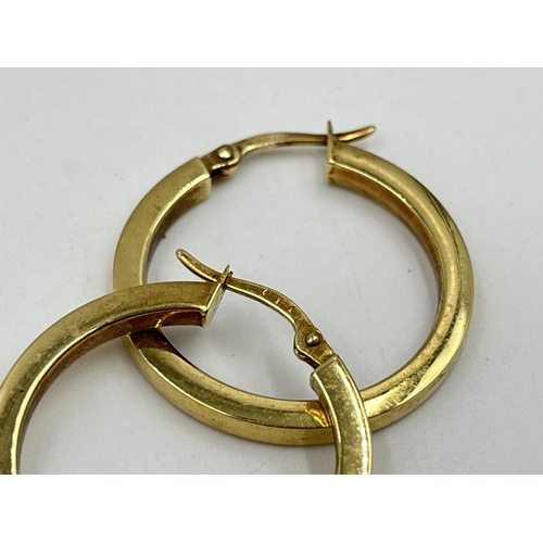 1243 - A pair of hallmarked 9ct gold hoop earrings - approx. gross weight 2 grams and 2.5cm diameter