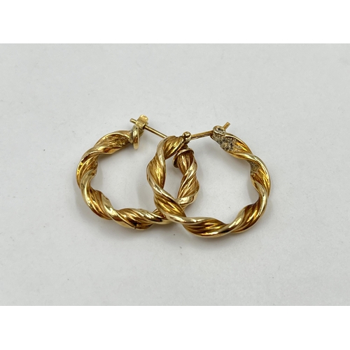 1244 - A pair of 9ct gold twisted hoop earrings - approx. gross weight 1.75 grams