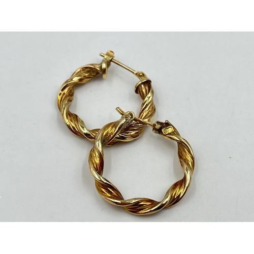 1244 - A pair of 9ct gold twisted hoop earrings - approx. gross weight 1.75 grams