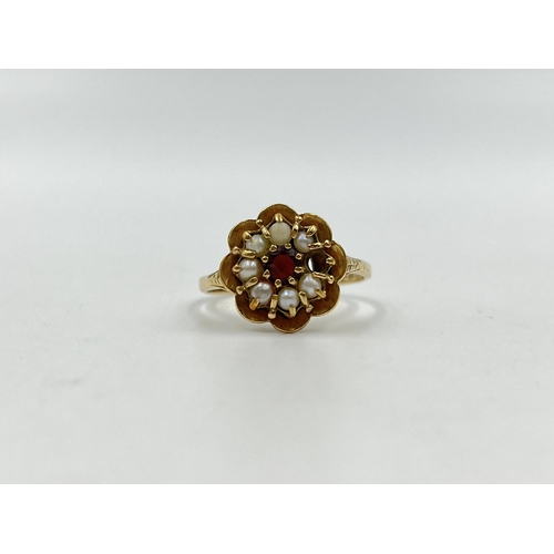 1247 - A hallmarked 9ct gold garnet and seed pearl floral ring, size T - approx. gross weight 3.86 grams