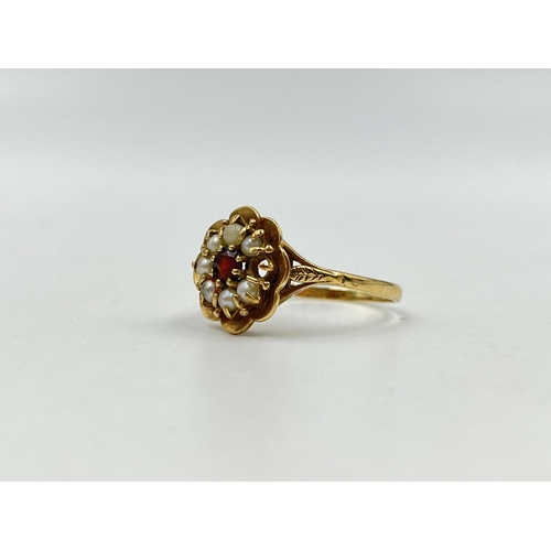 1247 - A hallmarked 9ct gold garnet and seed pearl floral ring, size T - approx. gross weight 3.86 grams