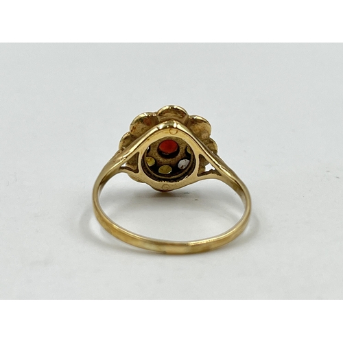 1247 - A hallmarked 9ct gold garnet and seed pearl floral ring, size T - approx. gross weight 3.86 grams