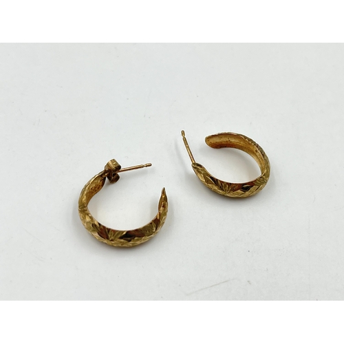 1249 - A pair of 9ct gold texture half hoop earrings - approx. gross weight 1.31 grams