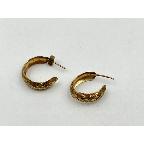 1249 - A pair of 9ct gold texture half hoop earrings - approx. gross weight 1.31 grams