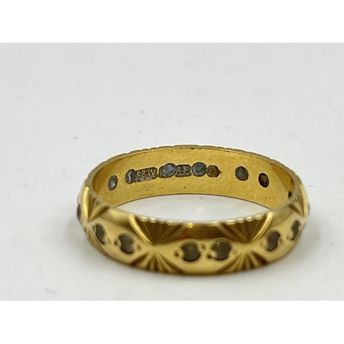 1251 - A hallmarked 18ct gold textured clear gemstone eternity ring, size M - approx. gross weight 3.16 gra... 