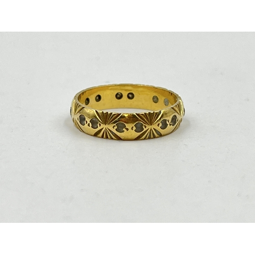 1251 - A hallmarked 18ct gold textured clear gemstone eternity ring, size M - approx. gross weight 3.16 gra... 