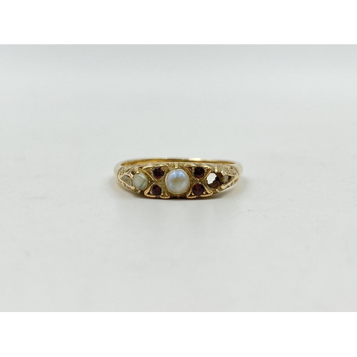 1253 - A 9ct gold garnet and seed pearl ring, size R½ - approx. gross weight 3 grams