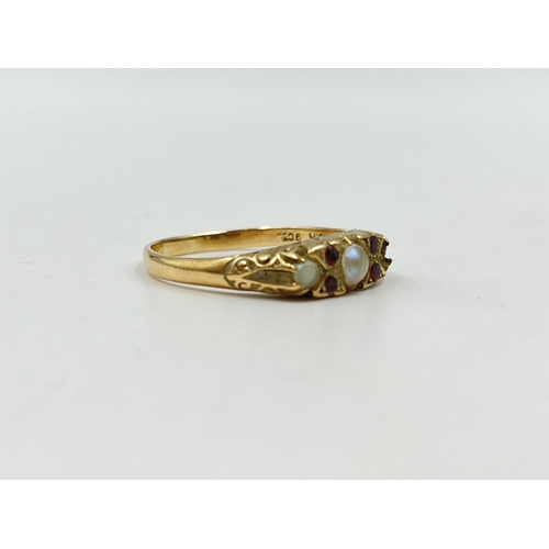 1253 - A 9ct gold garnet and seed pearl ring, size R½ - approx. gross weight 3 grams