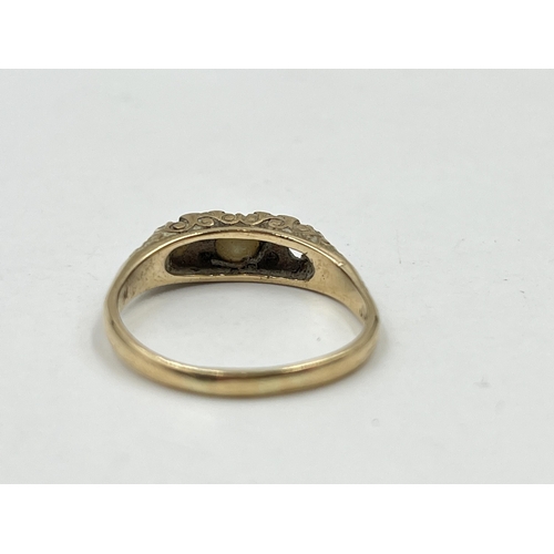 1253 - A 9ct gold garnet and seed pearl ring, size R½ - approx. gross weight 3 grams