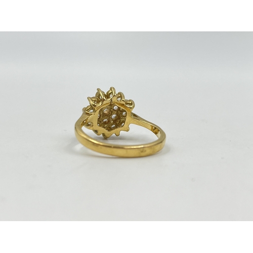 1254 - A yellow metal CZ cluster dress ring, stamped 18k to reverse, size R - approx. gross weight 3.67 gra... 