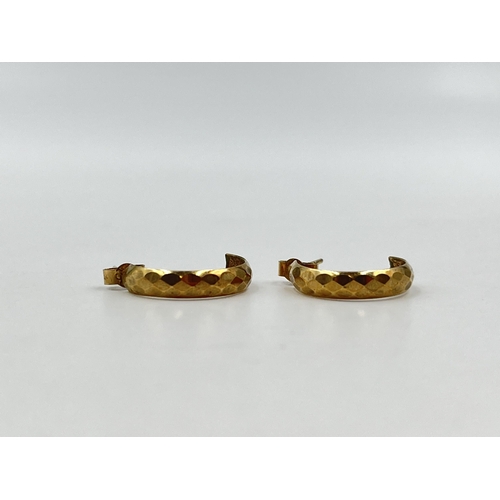 1257 - A pair of 9ct gold textured half hoop earrings - approx. gross weight 0.81 grams