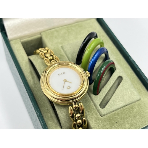 1275 - A vintage boxed Gucci 11/12 bezel change quartz lady's wristwatch with 5 bezels