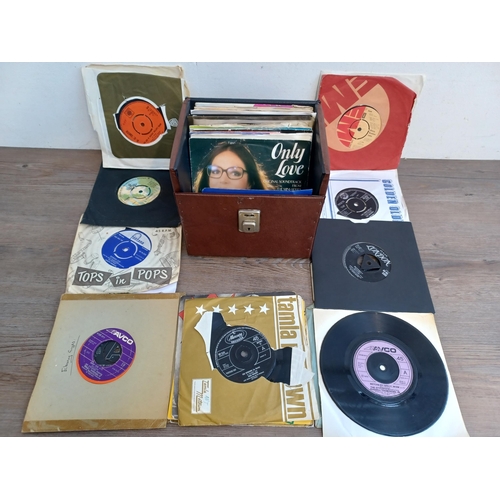 837 - A record case containing a collection of 7