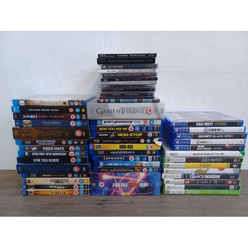 838 - A collection of rock CDs, PS4 and Xbox 360 game discs and Blu-rays with sealed titles to include The... 