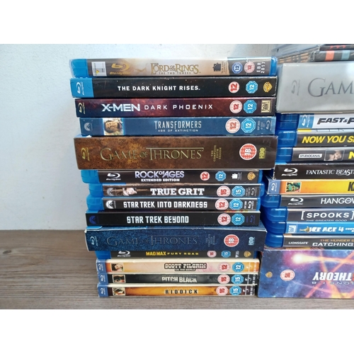 838 - A collection of rock CDs, PS4 and Xbox 360 game discs and Blu-rays with sealed titles to include The... 