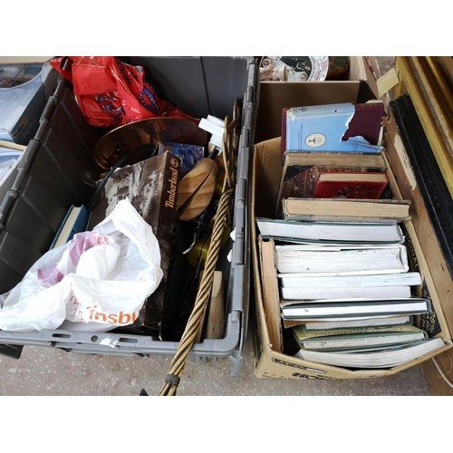 970B - Four boxes and two baskets containing board games, antique books, frames, cigarette cards, boxed flo... 