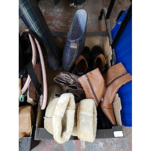 970C - Three boxes containing ladies fashion items comprising boots, belts and bags