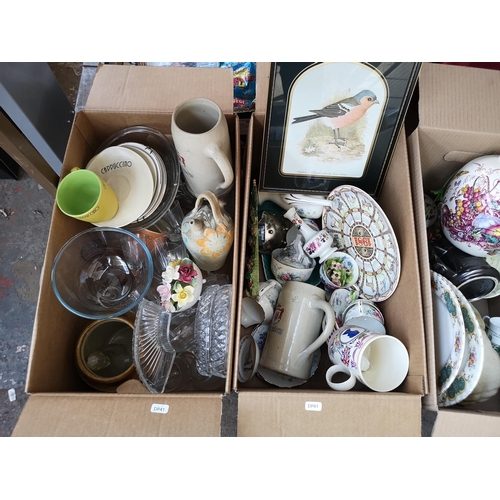 974 - Three boxes containing chromium effect standard lamp, 19th century style quartz wall clock, ceramics... 