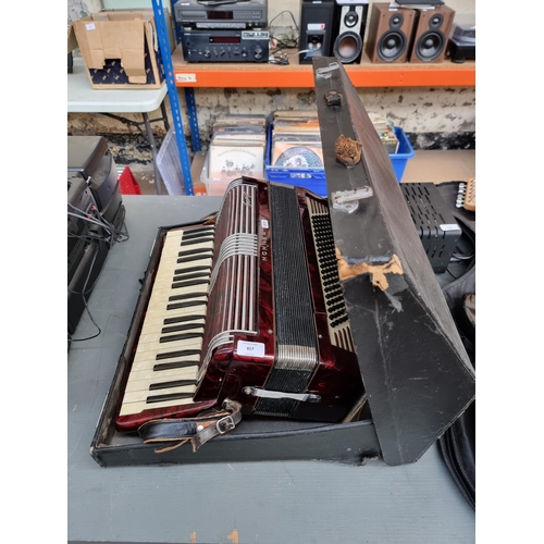 817 - A cased Hohner Tango 120 bass piano accordion