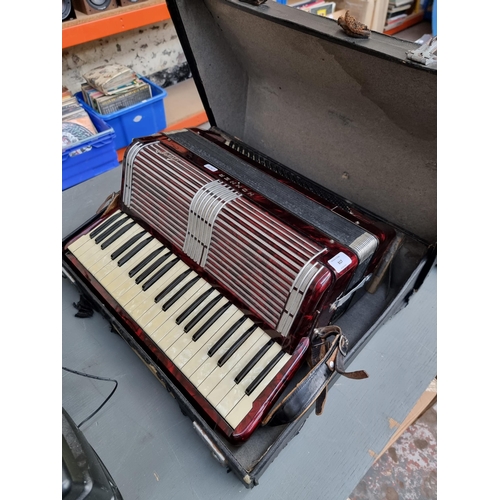 817 - A cased Hohner Tango 120 bass piano accordion