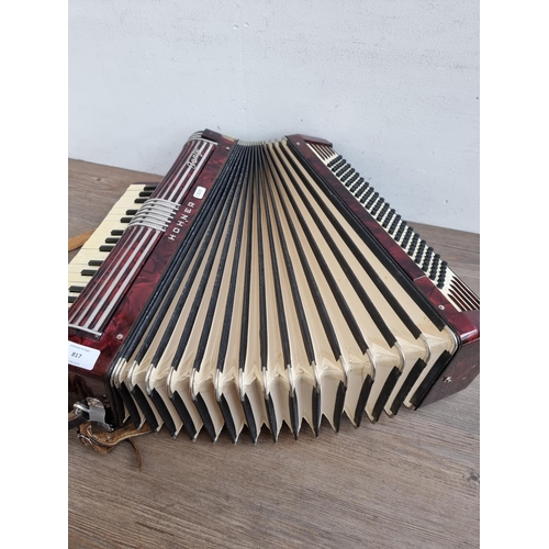 817 - A cased Hohner Tango 120 bass piano accordion