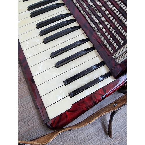 817 - A cased Hohner Tango 120 bass piano accordion