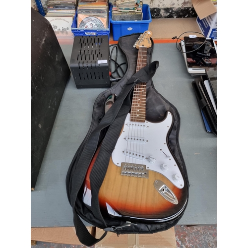 818 - Two items, one cased Crafter Cruiser sunburst Stratocaster style electric guitar with strap, pitch p... 