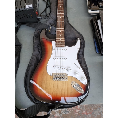 818 - Two items, one cased Crafter Cruiser sunburst Stratocaster style electric guitar with strap, pitch p... 