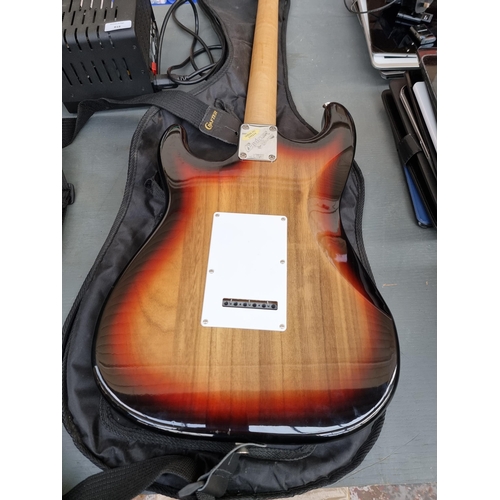 818 - Two items, one cased Crafter Cruiser sunburst Stratocaster style electric guitar with strap, pitch p... 