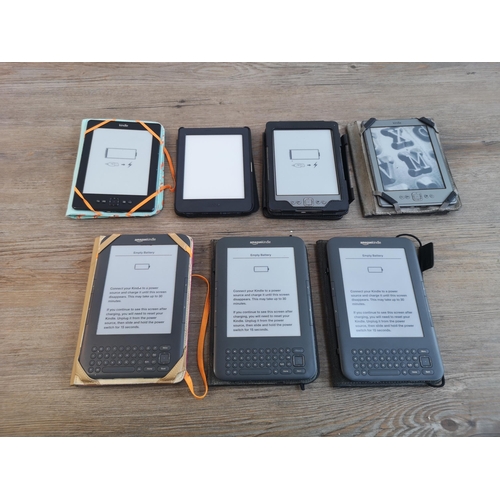 907 - Seven cased e-readers