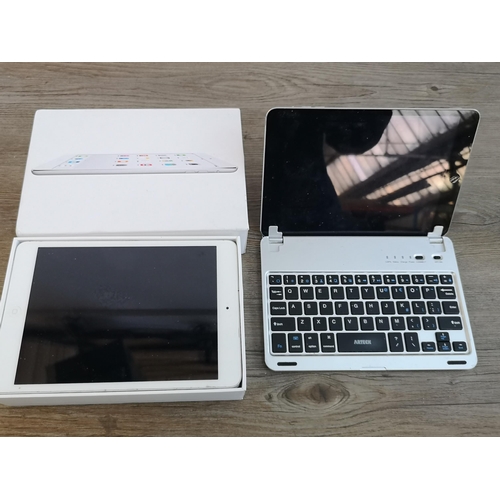 915 - Two Apple A1489 iPad Mini tablets one boxed and one with keyboard