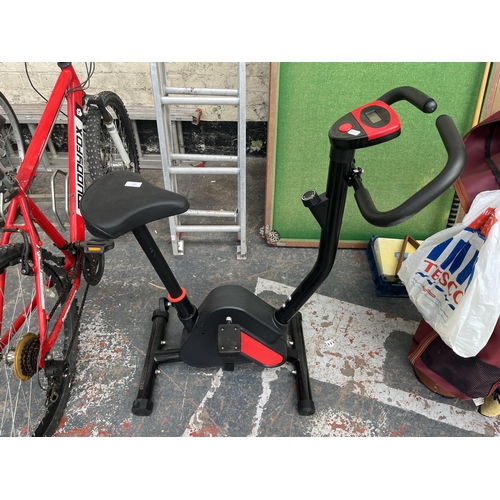 707 - An unbranded exercise bike with digital read out