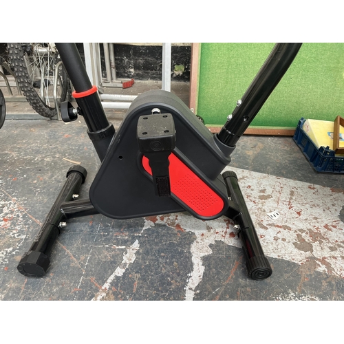 707 - An unbranded exercise bike with digital read out