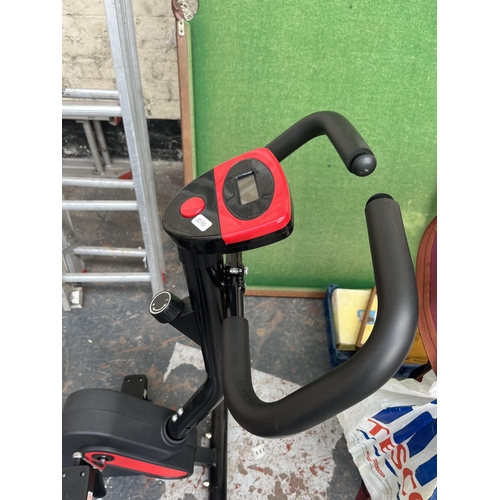 707 - An unbranded exercise bike with digital read out