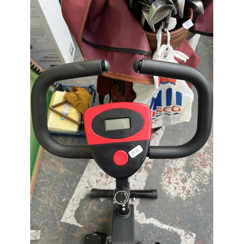 707 - An unbranded exercise bike with digital read out