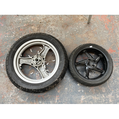 715 - Two motorbike wheels, one 13