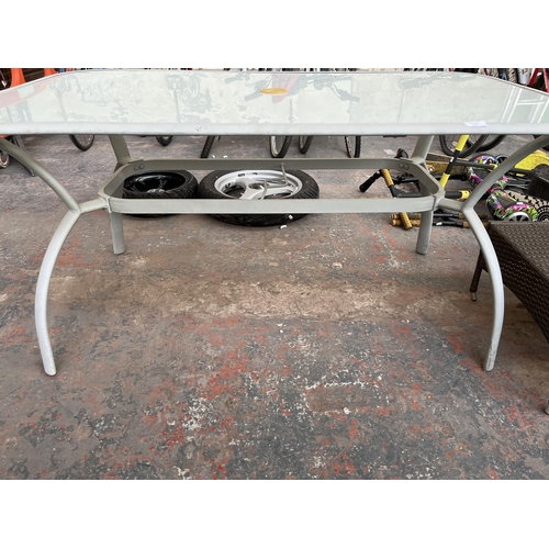 721 - A tubular and metal glass top garden table