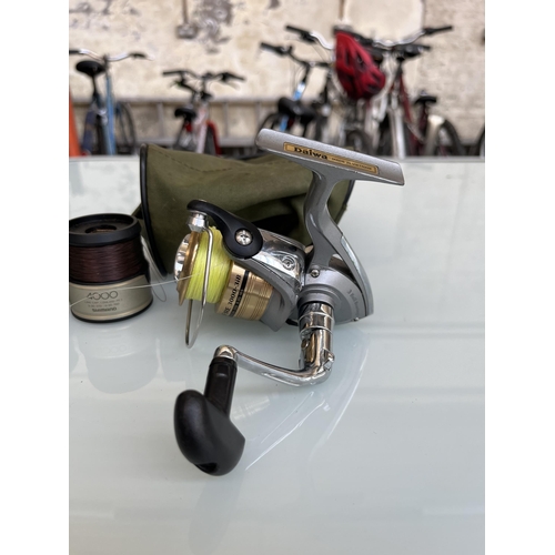 Three items, one Daiwa CrossFire 3000-3iB spinning reel and two