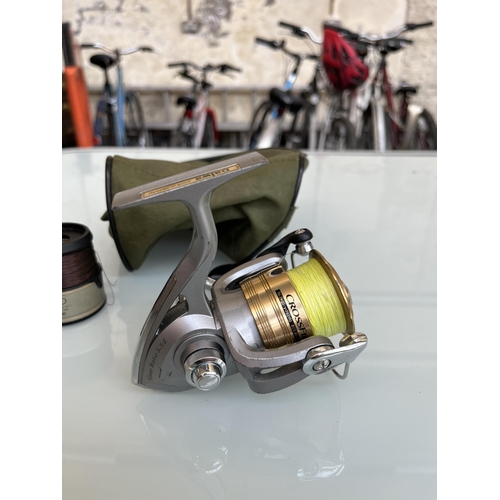 Three items, one Daiwa CrossFire 3000-3iB spinning reel and two