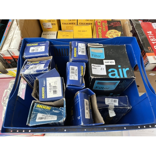 758 - A large collection of boxed car parts and car workshop manuals to include oil filters, timing belts,... 