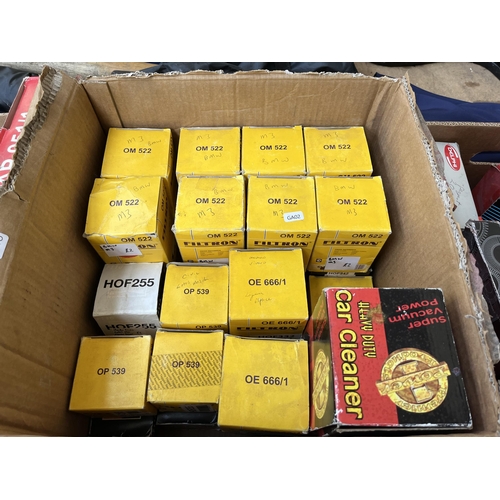 758 - A large collection of boxed car parts and car workshop manuals to include oil filters, timing belts,... 